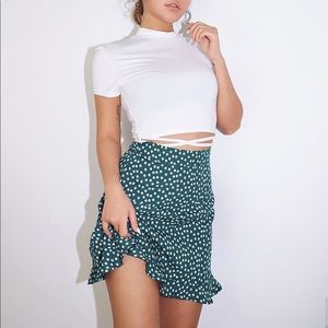 Green floral mini skirt